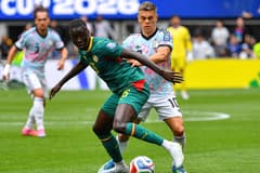 Pape Gueye, Leandro Trossard, Senegal v Belgium