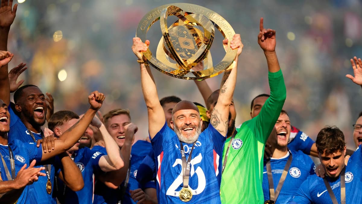Chelsea manager Enzo Maresca lifts the Club World Cup trophy