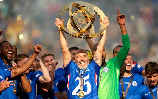 Chelsea manager Enzo Maresca lifts the Club World Cup trophy