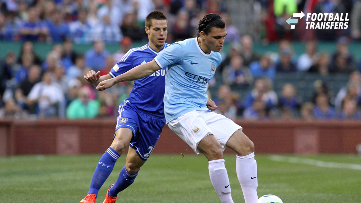 23 May 2013: Karim Rekik (right)(NED) of Manchester City shields the ball from Cesar Azpilicueta (28)(ESP) of Chelsea. Chelsea F.C. was defeated by Manchester City 3-4 at Busch Stadium in Saint Louis, Missouri, in a friendly exhibition soccer match....