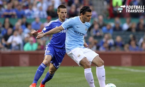 23 May 2013: Karim Rekik (right)(NED) of Manchester City shields the ball from Cesar Azpilicueta (28)(ESP) of Chelsea. Chelsea F.C. was defeated by Manchester City 3-4 at Busch Stadium in Saint Louis, Missouri, in a friendly exhibition soccer match....