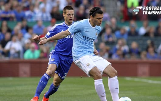23 May 2013: Karim Rekik (right)(NED) of Manchester City shields the ball from Cesar Azpilicueta (28)(ESP) of Chelsea. Chelsea F.C. was defeated by Manchester City 3-4 at Busch Stadium in Saint Louis, Missouri, in a friendly exhibition soccer match....