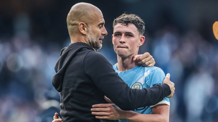 Pep Guardiola and Phil Foden