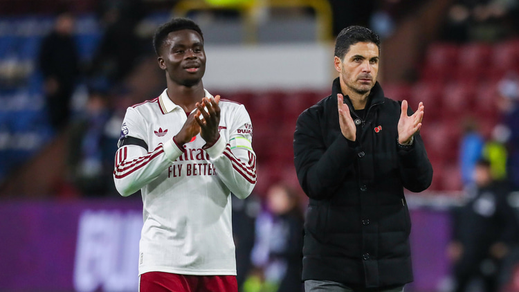 Bukayo Saka and Mikel Arteta