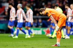 Tottenham goalkeeper Antonin Kinsky reacts to making a mistake against Atletico Madrid in the Champions League
