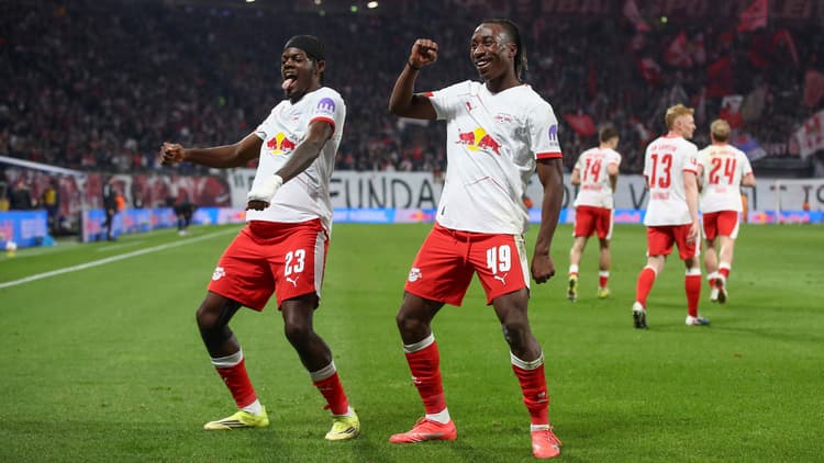 Yan Diomande (r) celebrates a Leipzig goal with Castello Lukeba