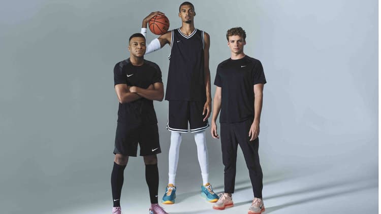 Kylian Mbappe (L) with Victor Wembanyama (C) and French swimmer Leon Marchand in 2025.