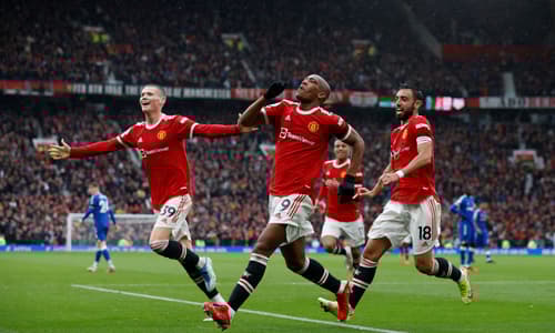 Anthony Martial celebrates with Man Utd team-mates Scott McTominay and Bruno Fernandes