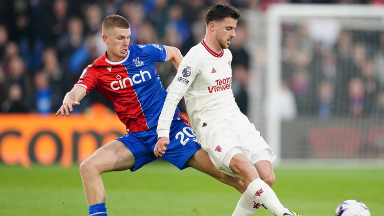 Adam Wharton in action against Man Utd's Mason Mount