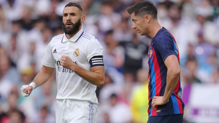 Robert Lewandowski (rechts) baalt na een treffer van Real Madrid.