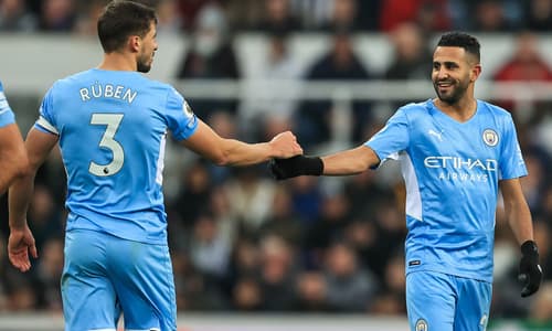 Riyad Mahrez and Ruben Dias celebrate for Manchester City in EPL 2021/22