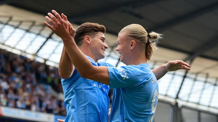 Julian Alvarez and Erling Haaland celebrate