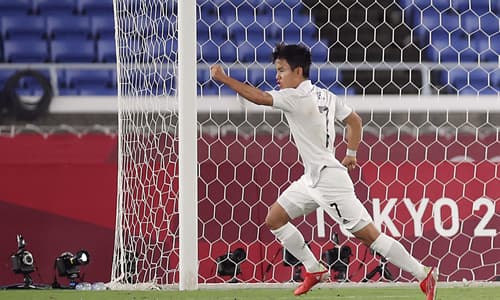 Real Madrid's Takefusa Kubo celebrates after scoring against France at the Olympics