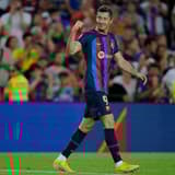 Robert Lewandowski celebrates a double for Barcelona against Valladolid