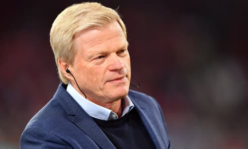 CEO Oliver Kahn pitchside at a Bayern Munich match.