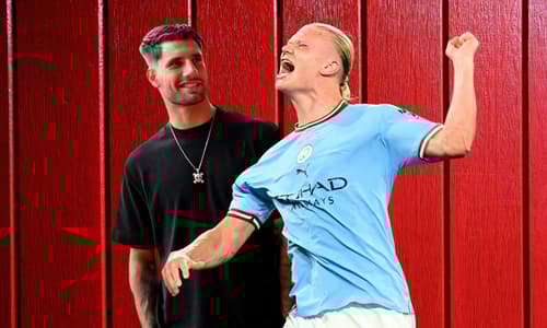 Domink Szoboszlai and Erling Haaland in front of a red fence background