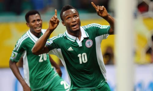 Chelsea midfielder Mikel Jon Obi celebrates scoring for Nigeria