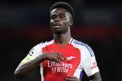 Bukayo Saka celebrates scoring for Arsenal against PSG in the Champions League