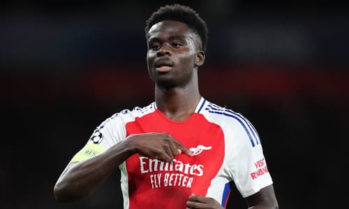 Bukayo Saka celebrates scoring for Arsenal against PSG in the Champions League