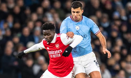 Bukayo Saka and Rodri during Arsenal vs. Man City in February.