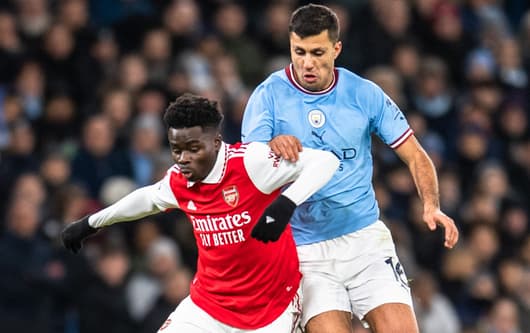 Bukayo Saka and Rodri during Arsenal vs. Man City in February.