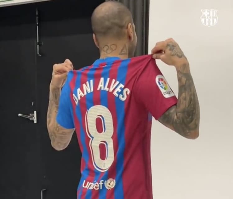 Why does Dani Alves wear No.8 for Barcelona?