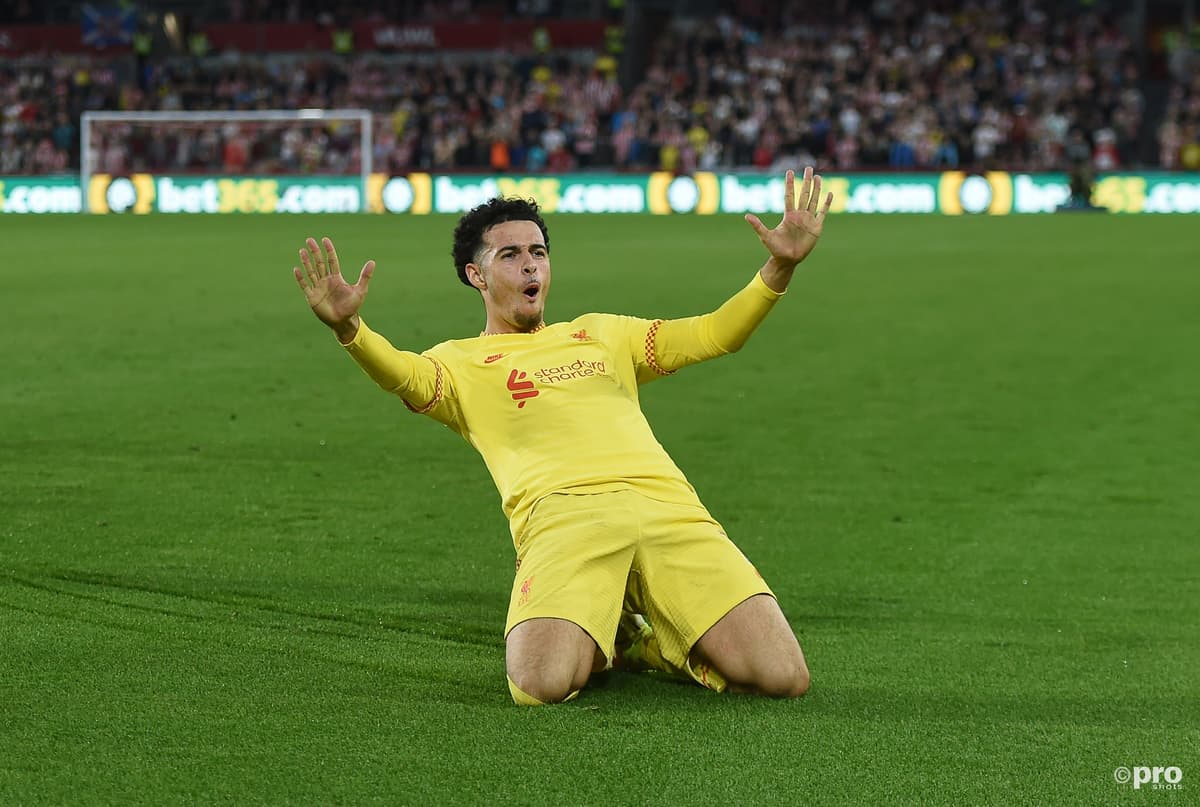 Curtis Jones celebrates scoring a goal for Liverpool in a Premier League match at Brentford Community Stadium against Brentford in 2021