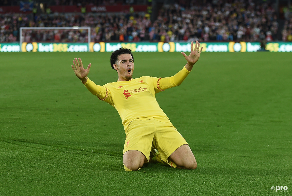 Curtis Jones celebrates scoring a goal for Liverpool in a Premier League match at Brentford Community Stadium against Brentford in 2021