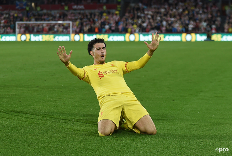 Curtis Jones celebrates scoring a goal for Liverpool in a Premier League match at Brentford Community Stadium against Brentford in 2021