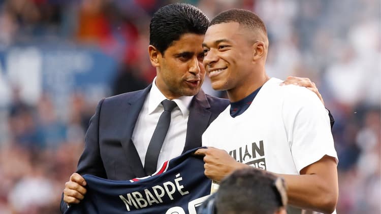 Nasser Al-Khelaifi and Kylian Mbappe pose at the Parc des Princes