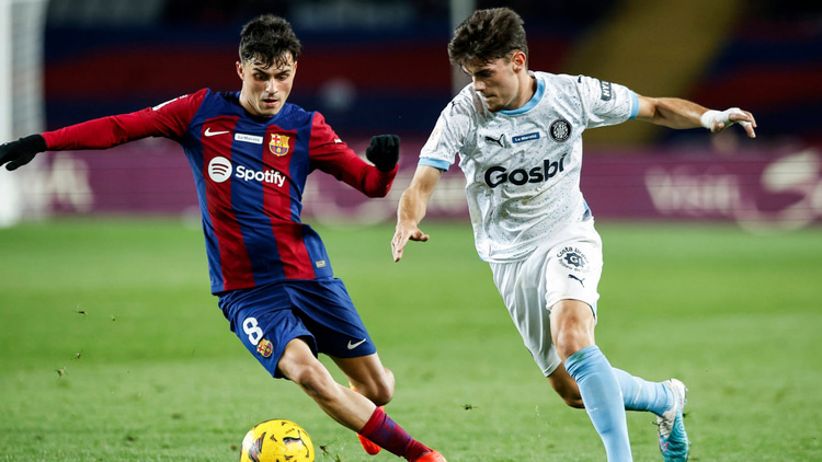 Pedri (left) in action against Girona