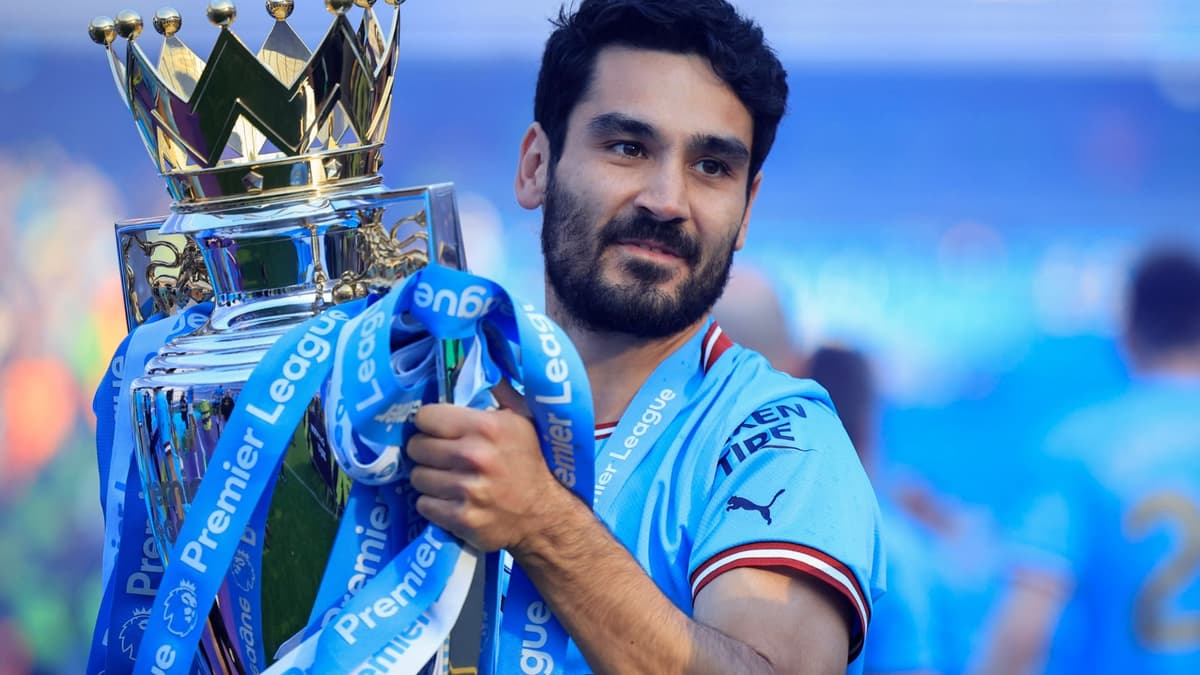 Ilkay Gundogan lifts the Premier League trophy