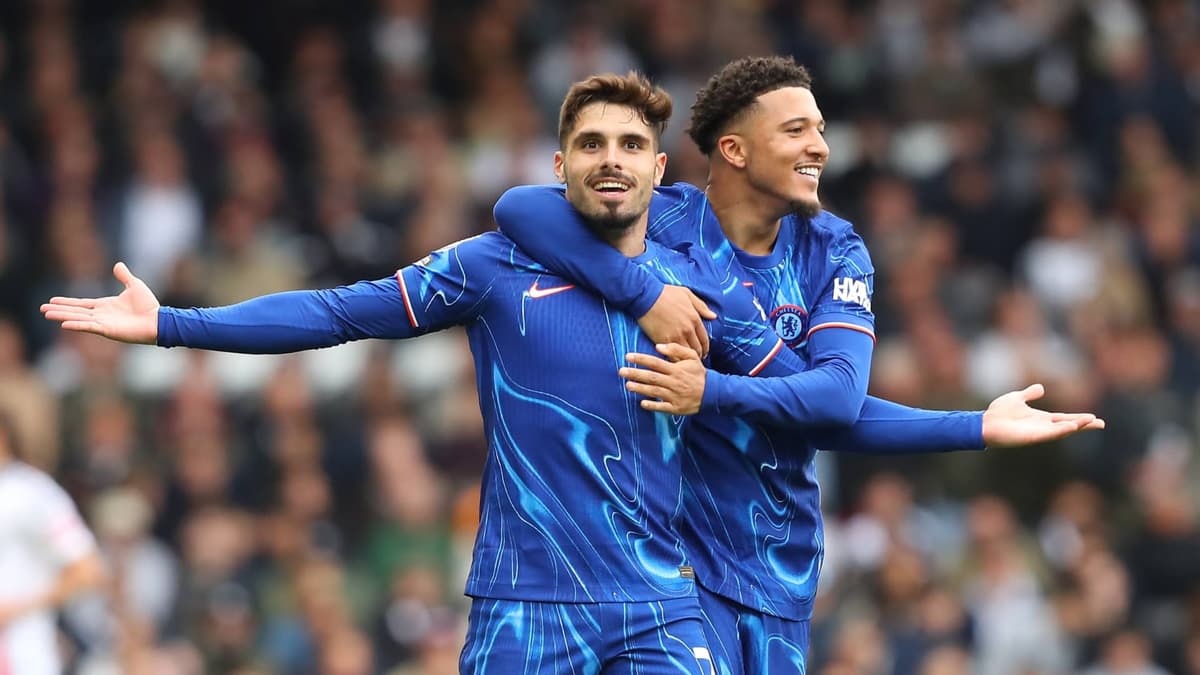 Pedro Neto and Jadon Sancho of Chelsea celebrate scoring against Fulham in the Premier League, 2024/25
