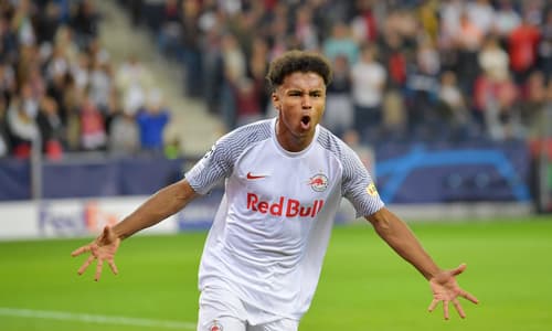 Karim Adeyemi celebrates scoring in the Champions League against Wolfsburg