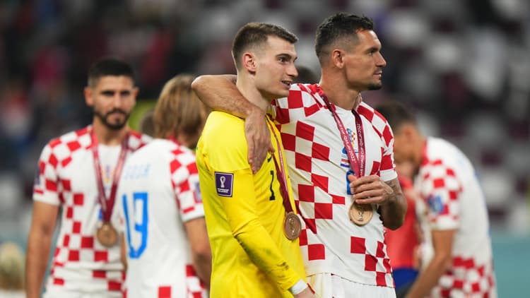 Dejan Lovren with Croatia goalkeeper Dominik Livakovic
