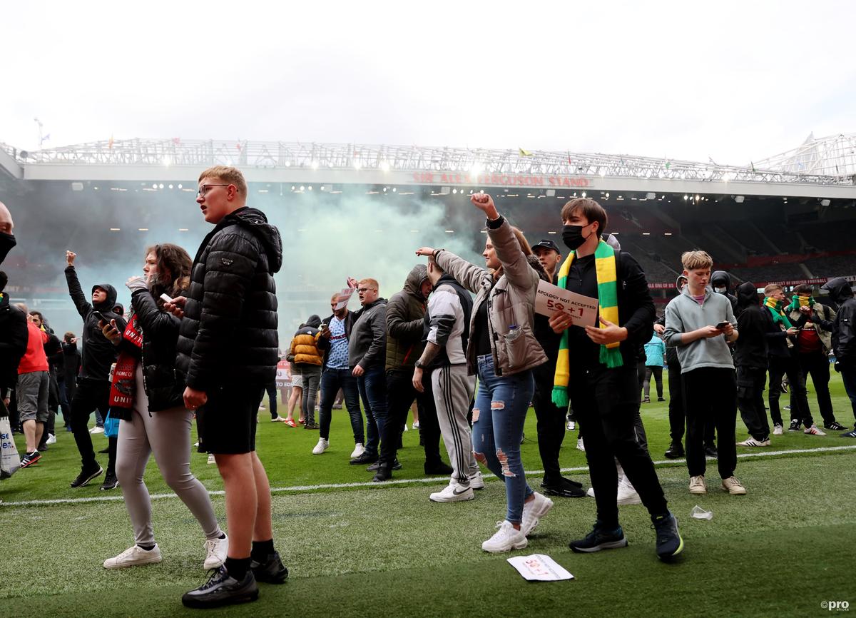 Man Utd-Liverpool game called off as hundreds of home fans break into Old Trafford, storm pitch & stop players leaving hotel