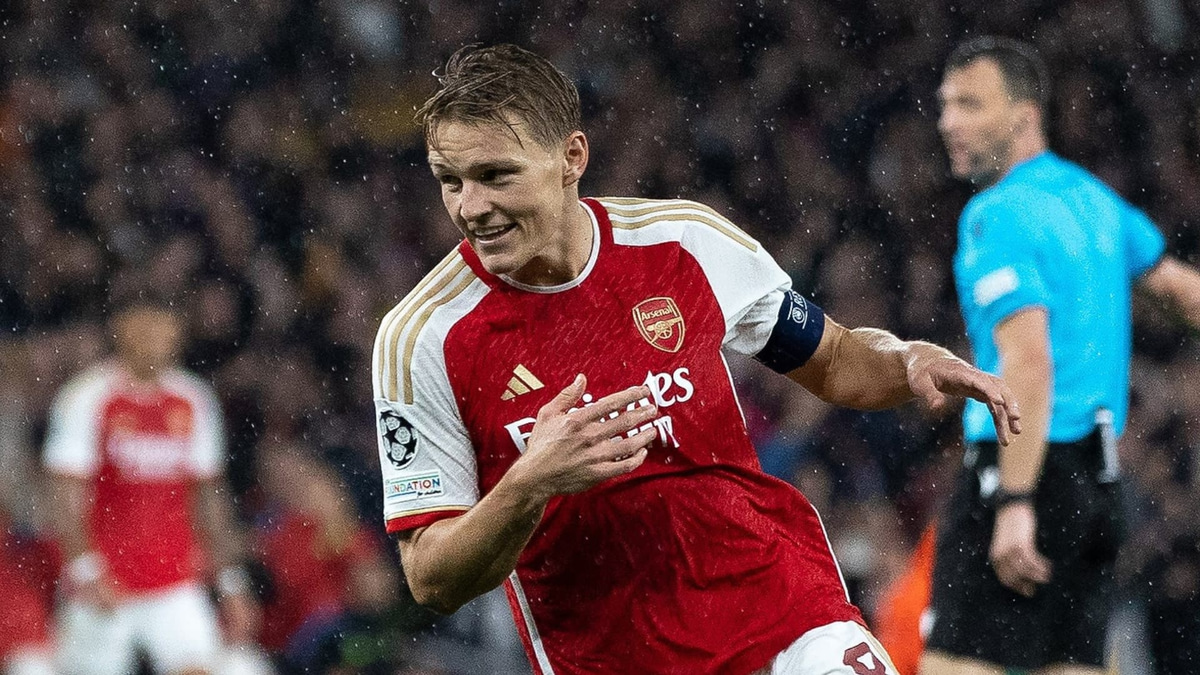 Martin Odegaard celebrates scoring for Arsenal against PSV in the Champions League