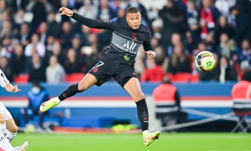 PSG's Kylian Mbappe shoots at goal in a Ligue 1 match vs Angers