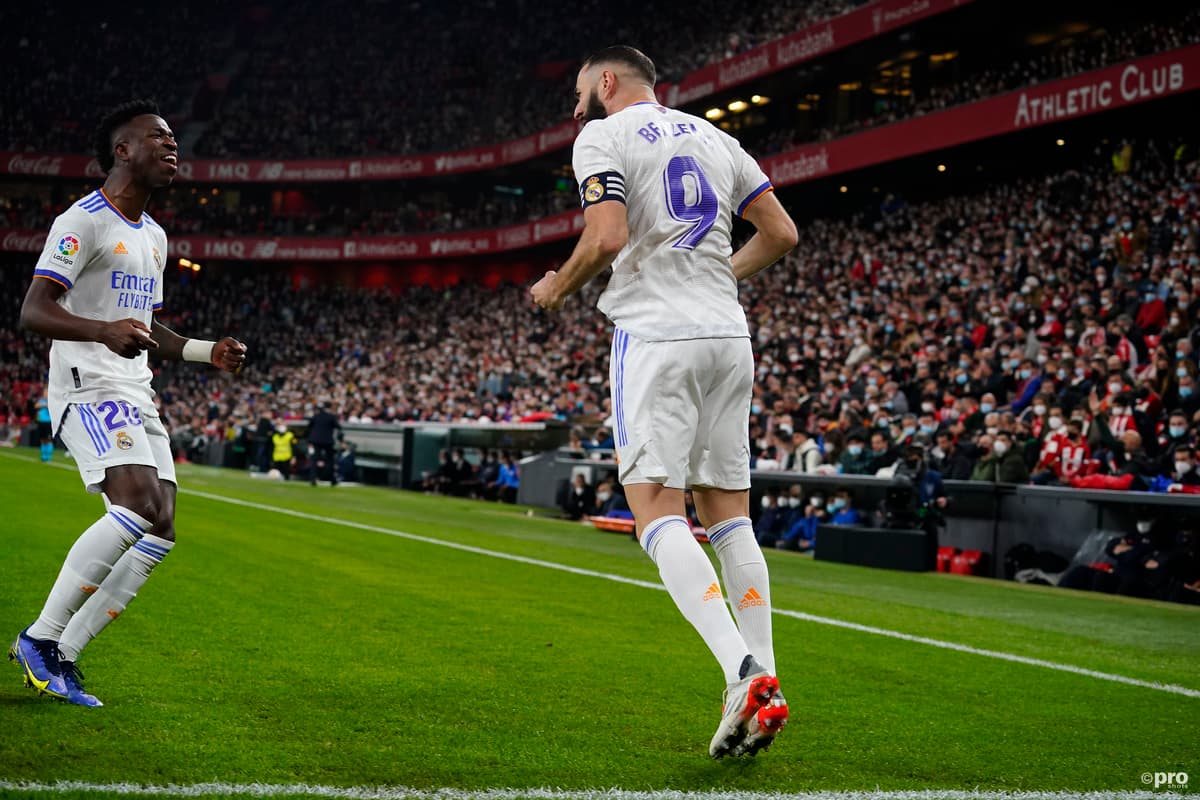 Benzema and Vinicius celebrate a Real Madrid goal in a LaLiga match vs Athletic.