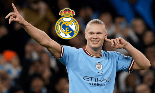 Erling Haaland of Manchester City with the Real Madrid badge