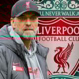 Jurgen Klopp and the Liverpool badge on a red and black abstract background