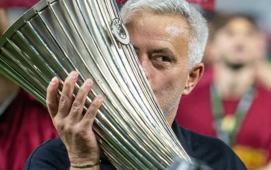 Jose Mourinho celebrates winning the Conference League with Roma