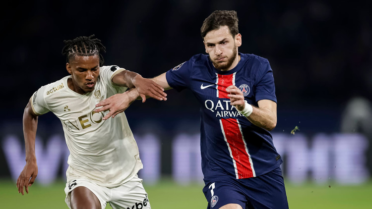 Hicham Boudaoui in action against PSG's Khvicha Kvaratskhelia