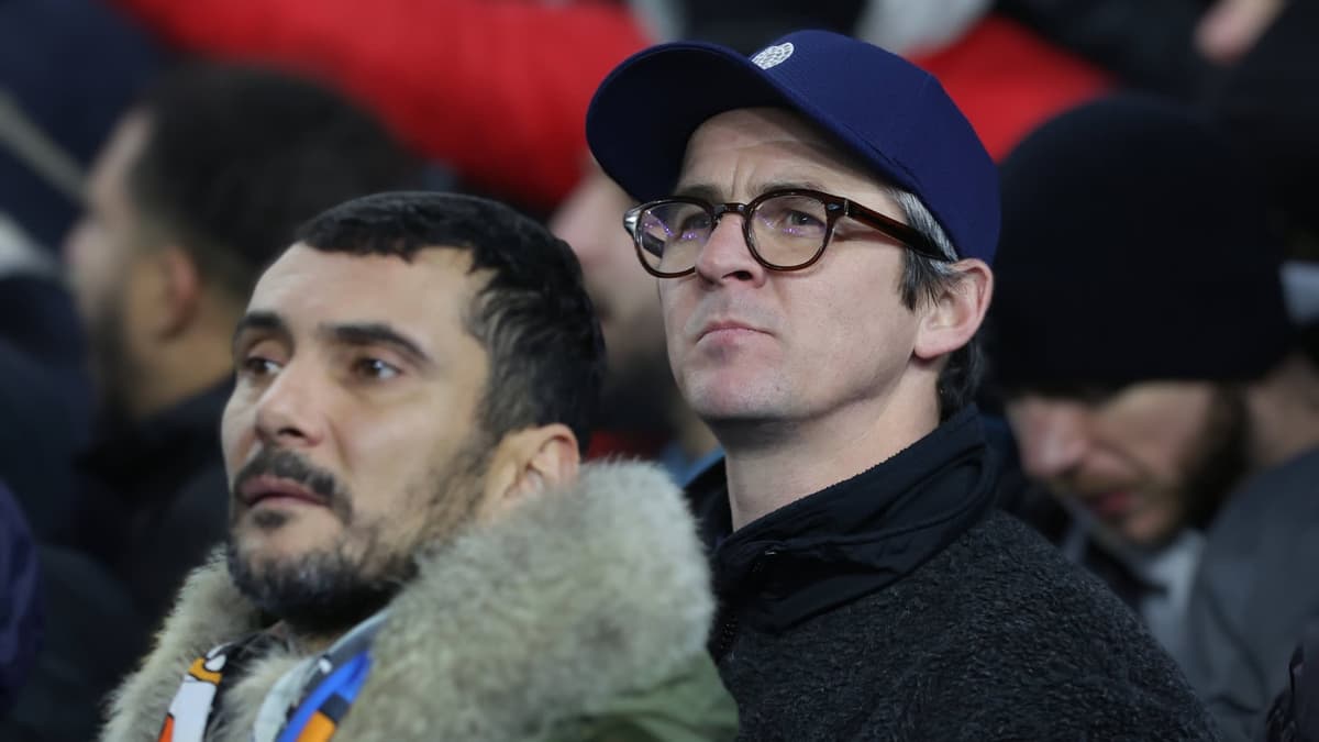 Joey Barton standing in the Marseille fans for the Europa League match with Brighton