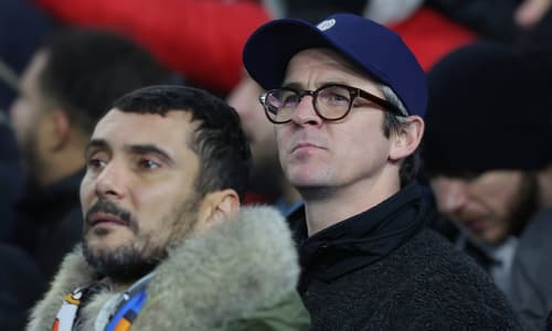 Joey Barton standing in the Marseille fans for the Europa League match with Brighton