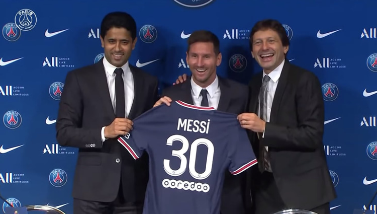 Lionel Messi at his PSG presentation with Nasser Al-Khelaifi and Leonardo
