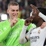 Andriy Lunin and Eduardo Camavinga of Real Madrid celebrate winning the 2023/24 Champions League