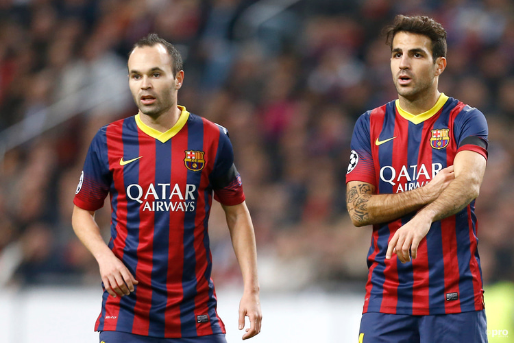 Cesc Fabregas and Andres Iniesta playing for Barcelona against Ajax in the Champions League in 2013/14