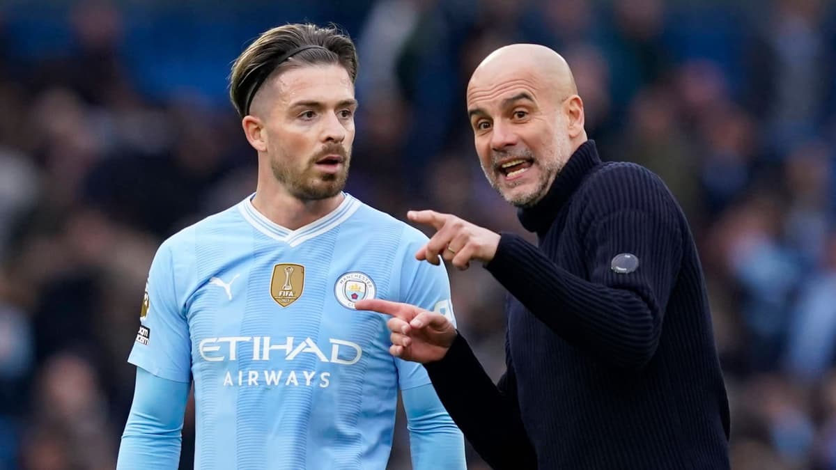 Pep Guardiola speaks to Jack Grealish after Man City draw 0-0 with Arsenal in the Premier League