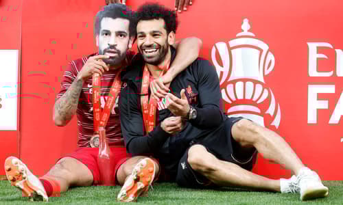 Mohamed Salah and Thiago Alcantara celebrate winning the 2022 FA Cup final with Liverpool
